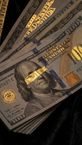 A timeless old money inspired wallpaper featuring stacks of cash and a premium aesthetic. This black background image is perfect for creating a phone screen that feels motivating and luxurious. Gold 
